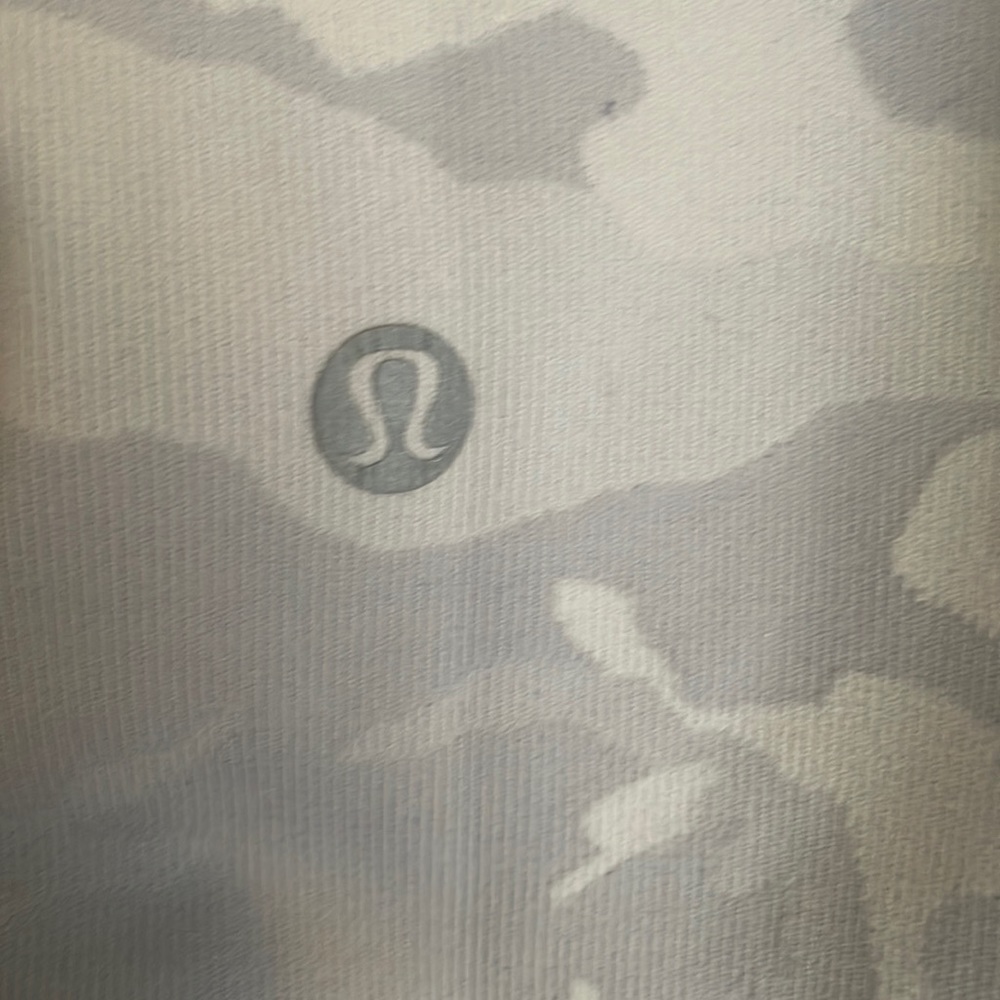 White camo Lululemon leggings. A bit of pilling in inner thigh. Good condition.